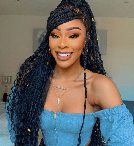Bohemian box braids with a side swoop 